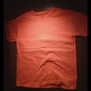 A orange fruit of the loom shirt